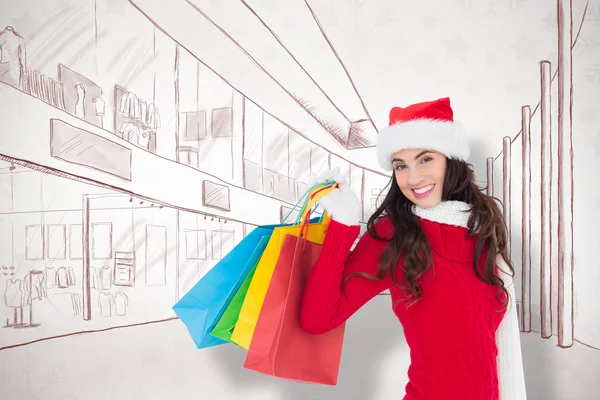 Feestelijke brunette in winter slijtage houden winkelen — Stockfoto