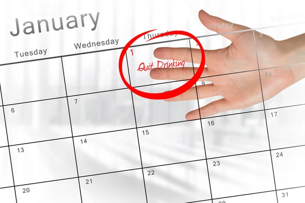 Nieuwe jaar resolutie tegen kalender — Stockfoto