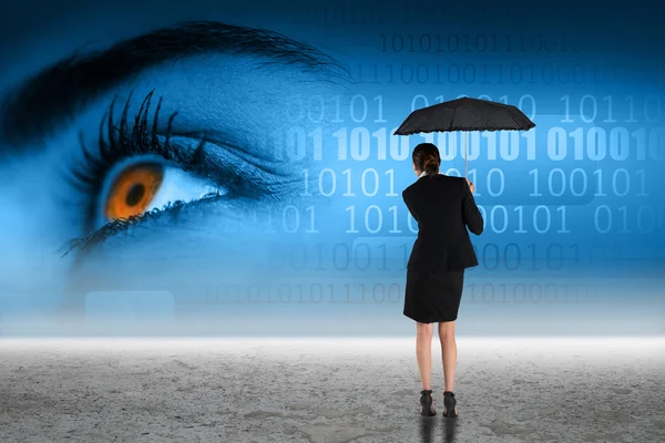 Young businesswoman holding umbrella — Stock Photo, Image