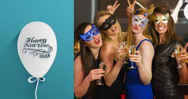 Women wearing masks holding champagne — Stock Photo, Image