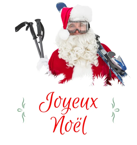 Happy santa posing with ski and ski poles — Stock Photo, Image