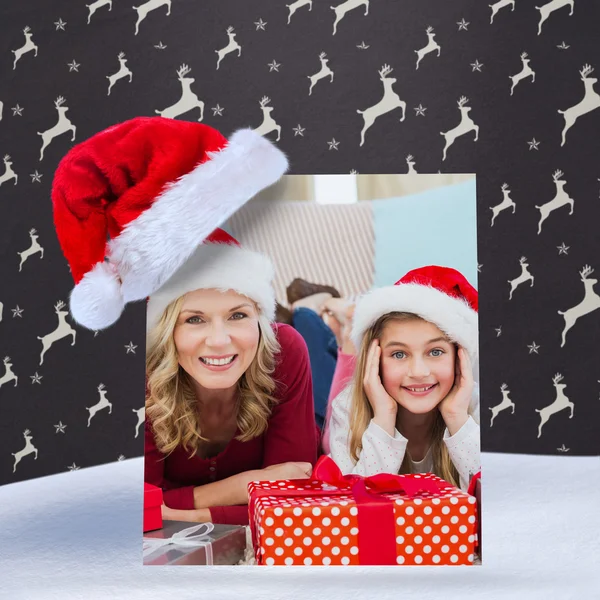 Festive little girl with mother surrounded — Stock Photo, Image
