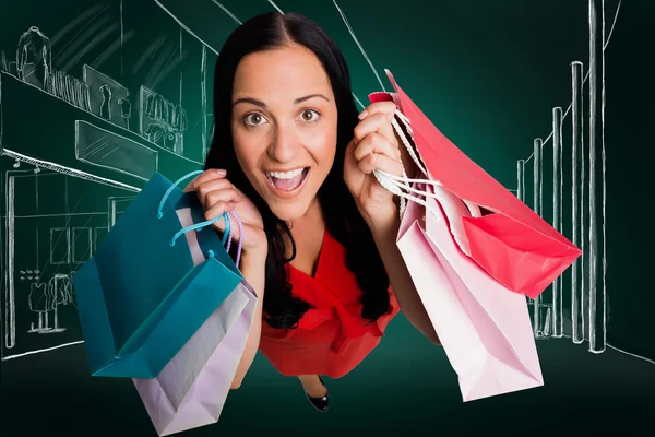 Mujer de pie con bolsas de compras — Foto de Stock