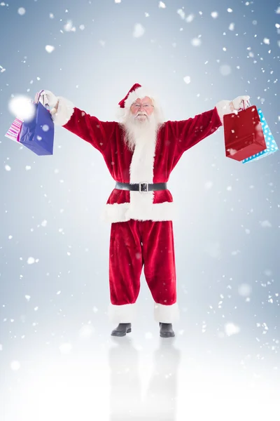 Babbo Natale tiene alcune borse per Natale — Foto Stock