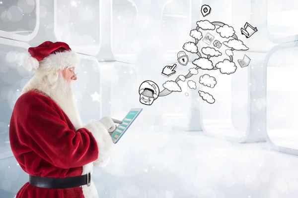 Santa uses a tablet pc — Stock Photo, Image