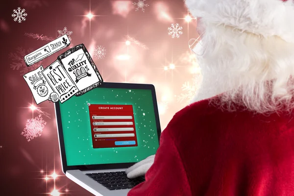 Santa Claus utiliza un ordenador portátil — Foto de Stock