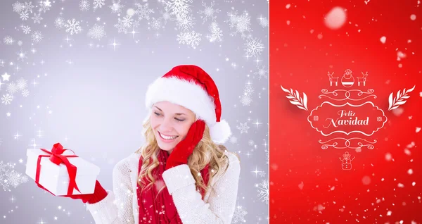 Happy festive blonde with gift — Stock Photo, Image