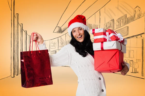 Smiling woman with christmas presents — Stock Photo, Image