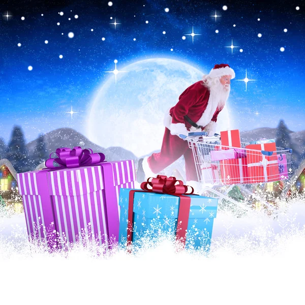 Santa tlačí nákupního košíku — Stock fotografie