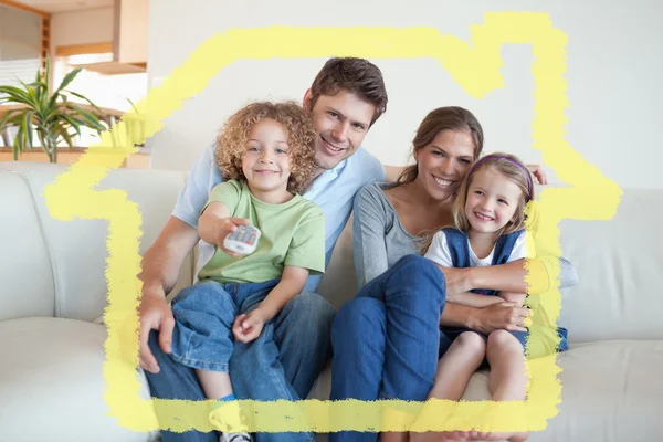 Smiling family watching tv together — Stock Photo, Image