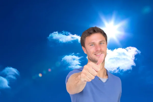 Smiling man giving thumbs up — Stock Photo, Image