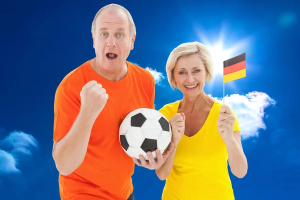 Happy german couple cheering — Stock Photo, Image