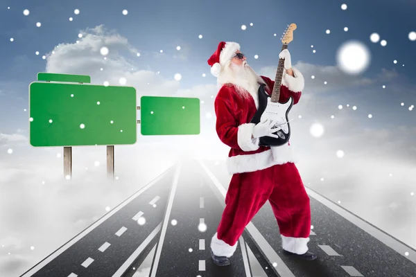 Santa playing electric guitar — Stock Photo, Image