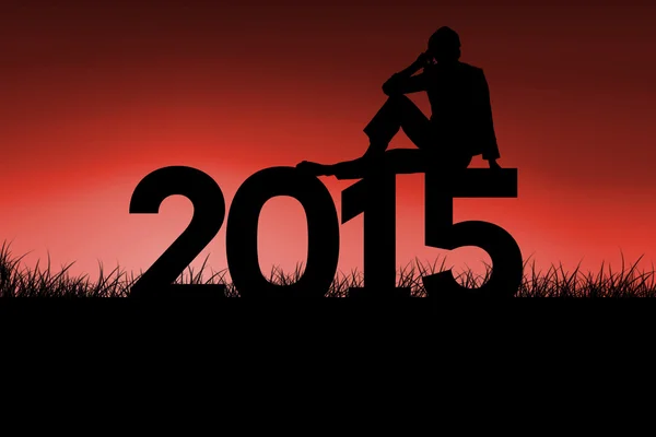 Woman sitting on 2015 sign — Stock Photo, Image