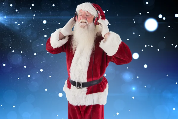 Santa Claus cieszy się trochę muzyki — Zdjęcie stockowe