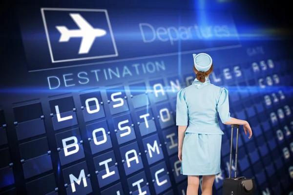 Air hostess leaning on suitcase — Stock Photo, Image