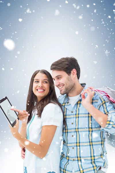 Casal feliz com sacos de compras — Fotografia de Stock