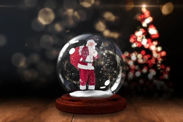 Santa vragen om stilte in sneeuw globe — Stockfoto