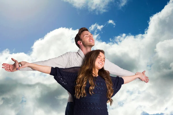 Romantic young couple with arms out — Stock Photo, Image