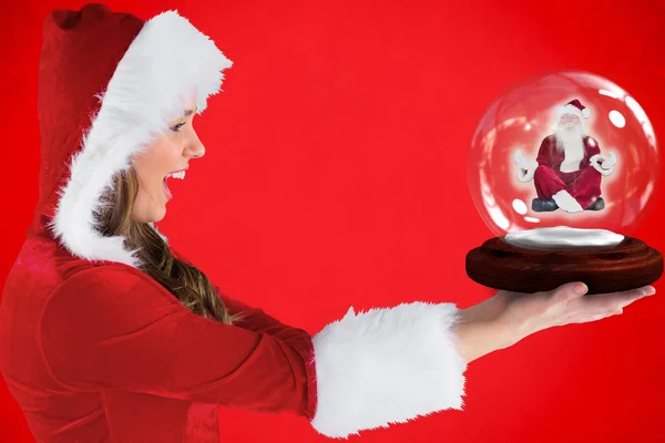 Sexy santa meisje houdt van sneeuw globe — Stockfoto