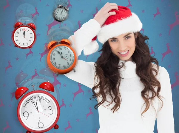 Confused brunette in santa hat — Stock Photo, Image