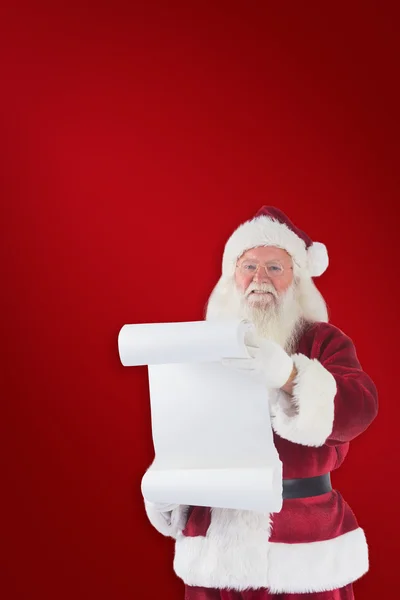 Father Christmas holds a list — Stock Photo, Image