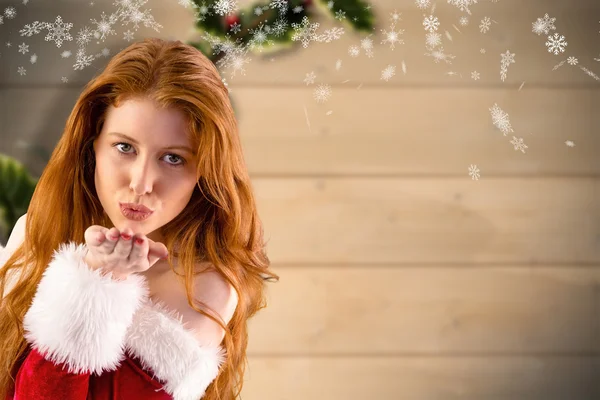 Festive redhead blowing kiss — Stock Photo, Image