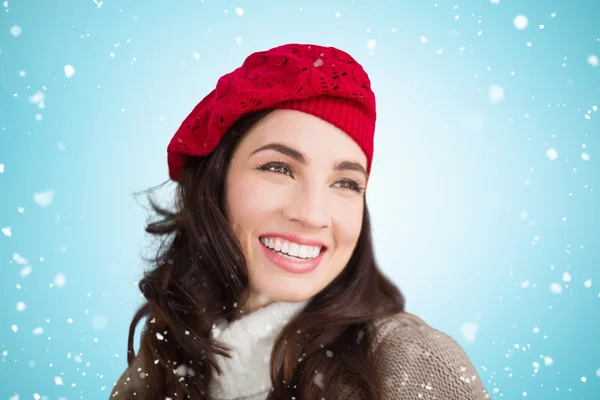 Composite image of smiling brunette — Stock Photo, Image