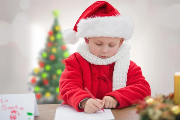 Composite image of cute boy drawing festive pictures — Stock Photo, Image