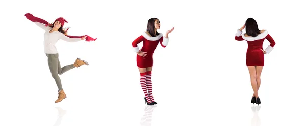 Verschiedene hübsche Mädchen im Weihnachtsmann-Outfit — Stockfoto