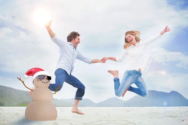 Festive sandman against couple — Stock Photo, Image