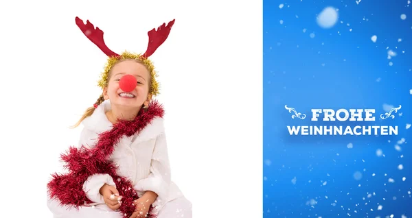 Cute little girl wearing red nose and tinsel — Stock Photo, Image