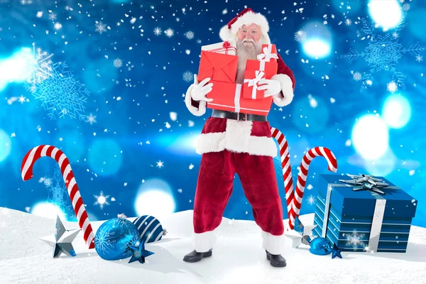 Santa prowadzi kilka prezentów — Zdjęcie stockowe