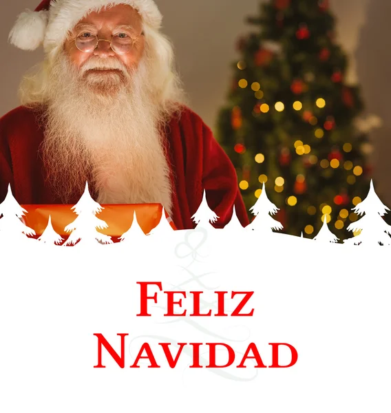 Happy santa drží zářící dárek — Stock fotografie