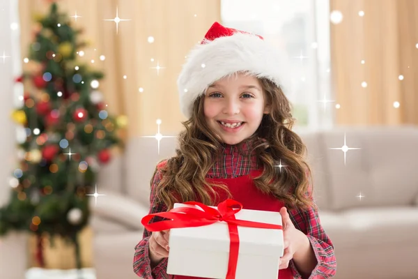 Festive little girl opening gift — Stock Photo, Image