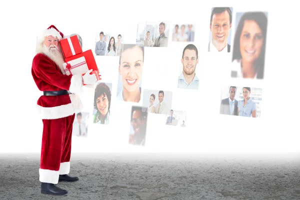 Immagine composita di Babbo Natale che porta doni — Foto Stock