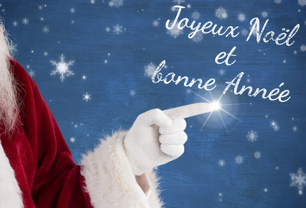 Santa claus points at something — Stock Photo, Image