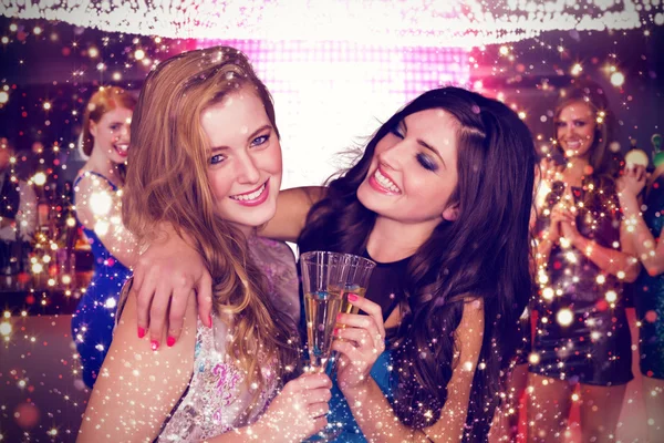 Composite image of friends drinking champagne — Stock Photo, Image