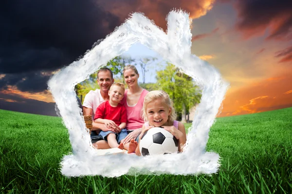 Little blond girl holding a soccer ball — Stock Photo, Image