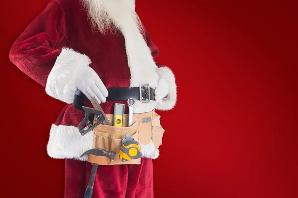 Father Christmas is wearing tool belt — Stock Photo, Image