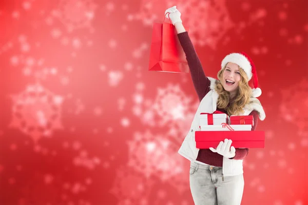 Rubia festiva con bolsa de compras y regalos —  Fotos de Stock