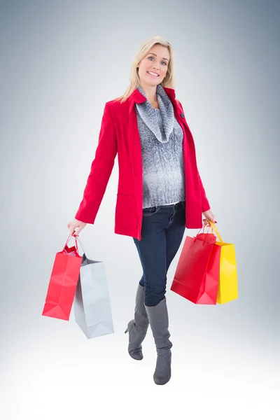 Blonde bedrijf shopping tassen — Stockfoto