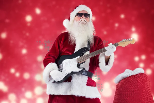 Santa Claus plays guitar with sunglasses — Stock Photo, Image