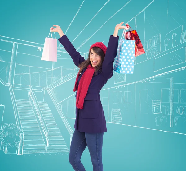 Morena sosteniendo bolsas de compras —  Fotos de Stock