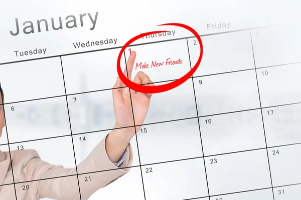 New years resolution against calendar — Stock Photo, Image