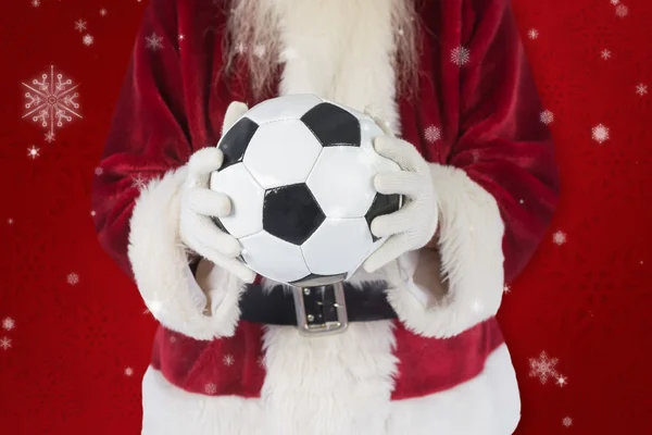 Santa hält klassischen Fußball — Stockfoto