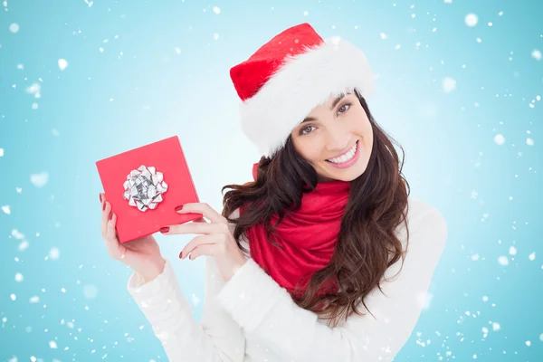 Joyful brunette presenting christmas gift Royalty Free Stock Images