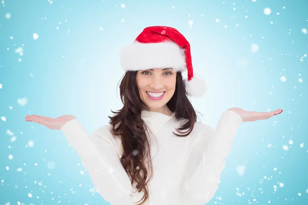Festive brunette holding hands out — Stock Photo, Image