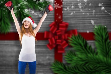 Festive redhead cheeering with boxing gloves clipart