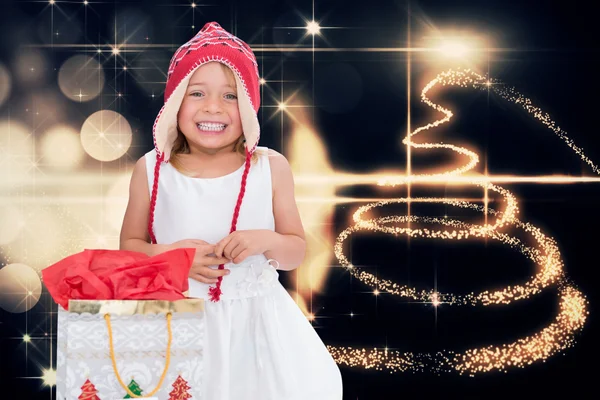 Composite image of cute girl at christmas — Stock Photo, Image